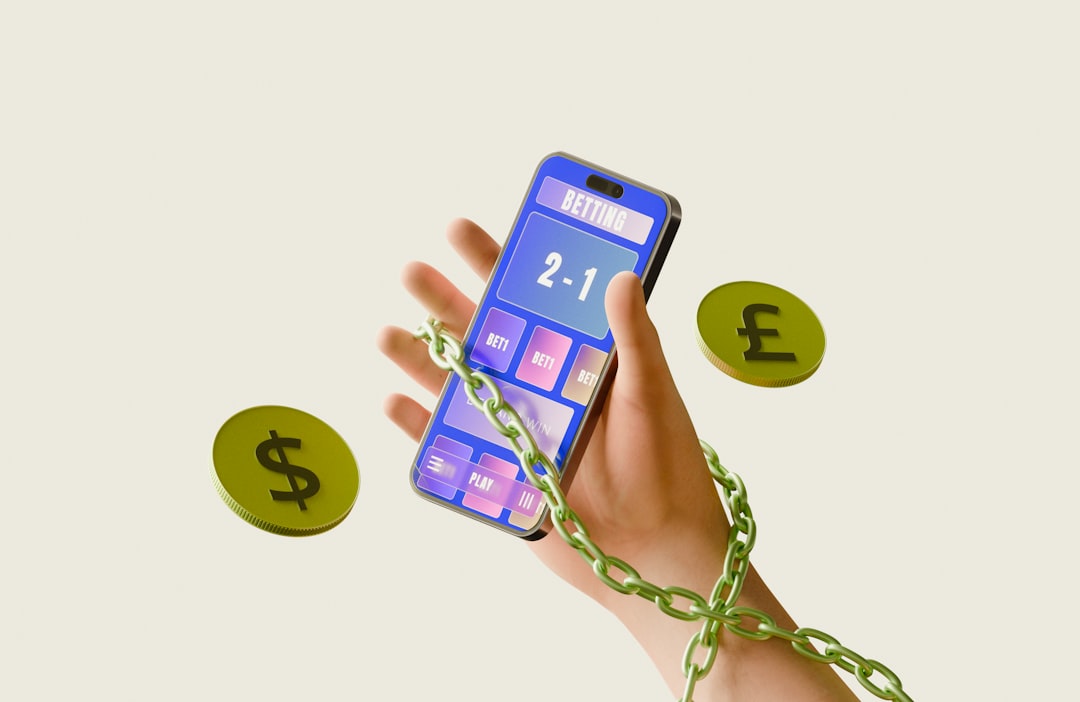 Chained hand holding smartphone calculator with dollar and pound coins